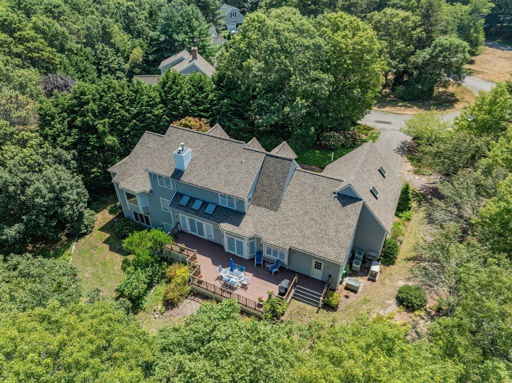 6 Match Point Dennis, MA 02638 - Photo 35 of 42 an aerial view of a house with yard and outdoor seating