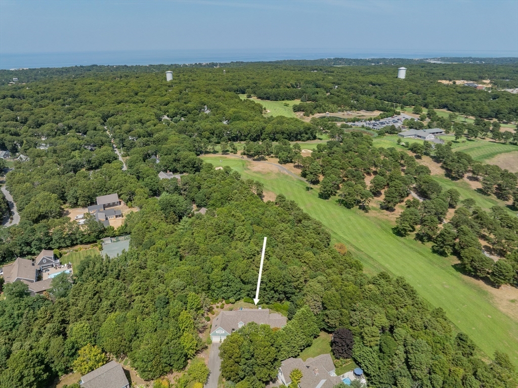 6 Match Point Dennis, MA 02638 - Photo 37 of 42 an aerial view of residential houses with outdoor space and trees