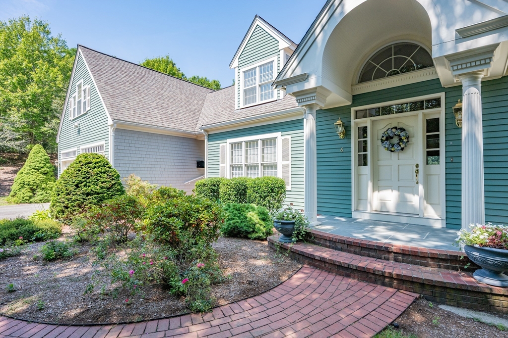 6 Match Point Dennis, MA 02638 - Photo 5 of 42 a front view of a house with garden