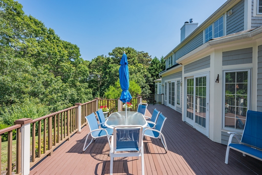 6 Match Point Dennis, MA 02638 - Photo 7 of 42 a view of a chair and table on the deck