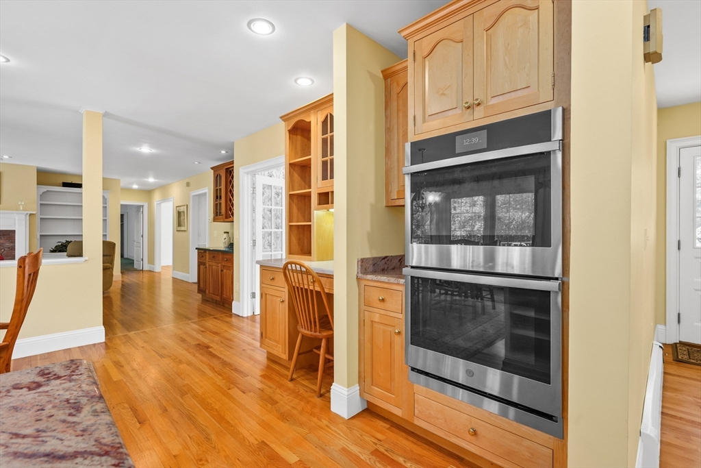 6 Match Point Dennis, MA 02638 - Photo 10 of 42 a view of a kitchen with an empty space and wooden floor