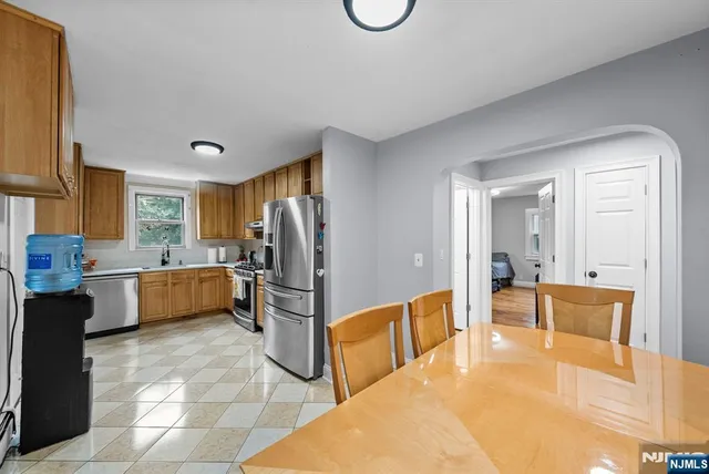 a bedroom with furniture and a wooden floor