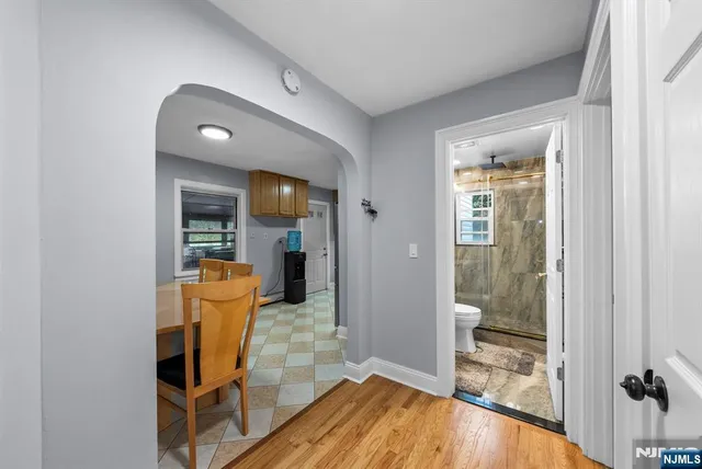 a bedroom with a bed and a flat screen television