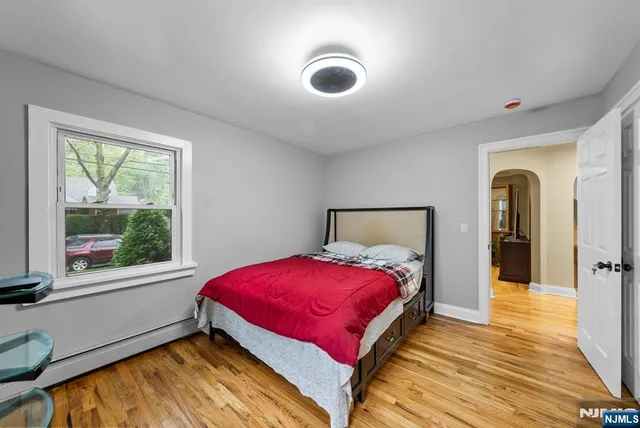 an aerial view of a house with a yard basket ball court and outdoor seating
