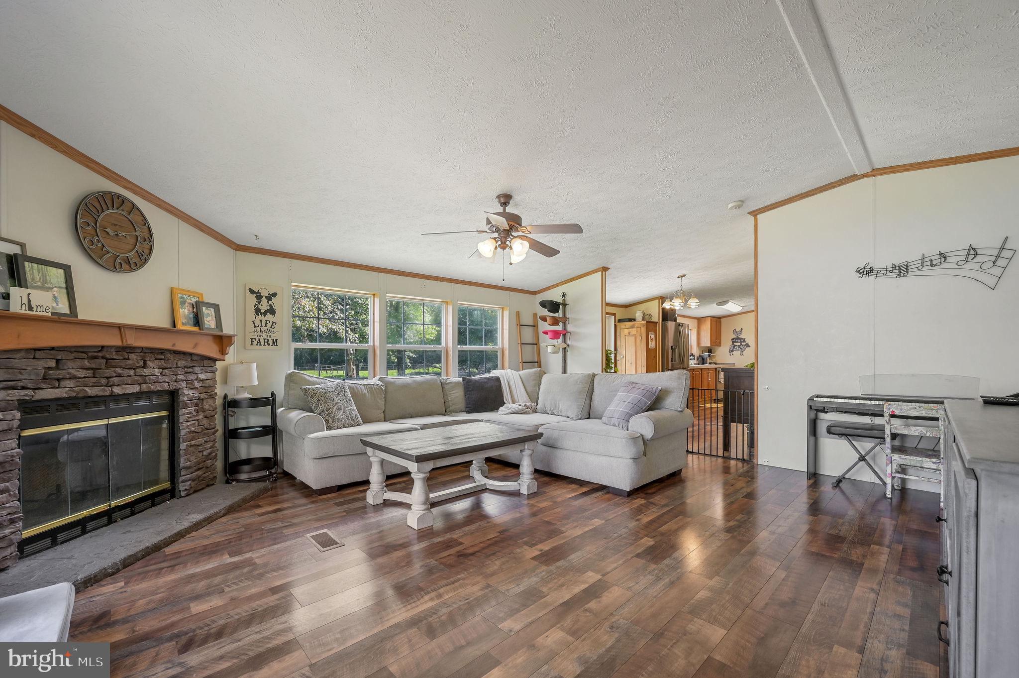 440 Indian Runner Road Felton, DE 19943 - Photo 15 of 50 a living room with furniture and a fireplace