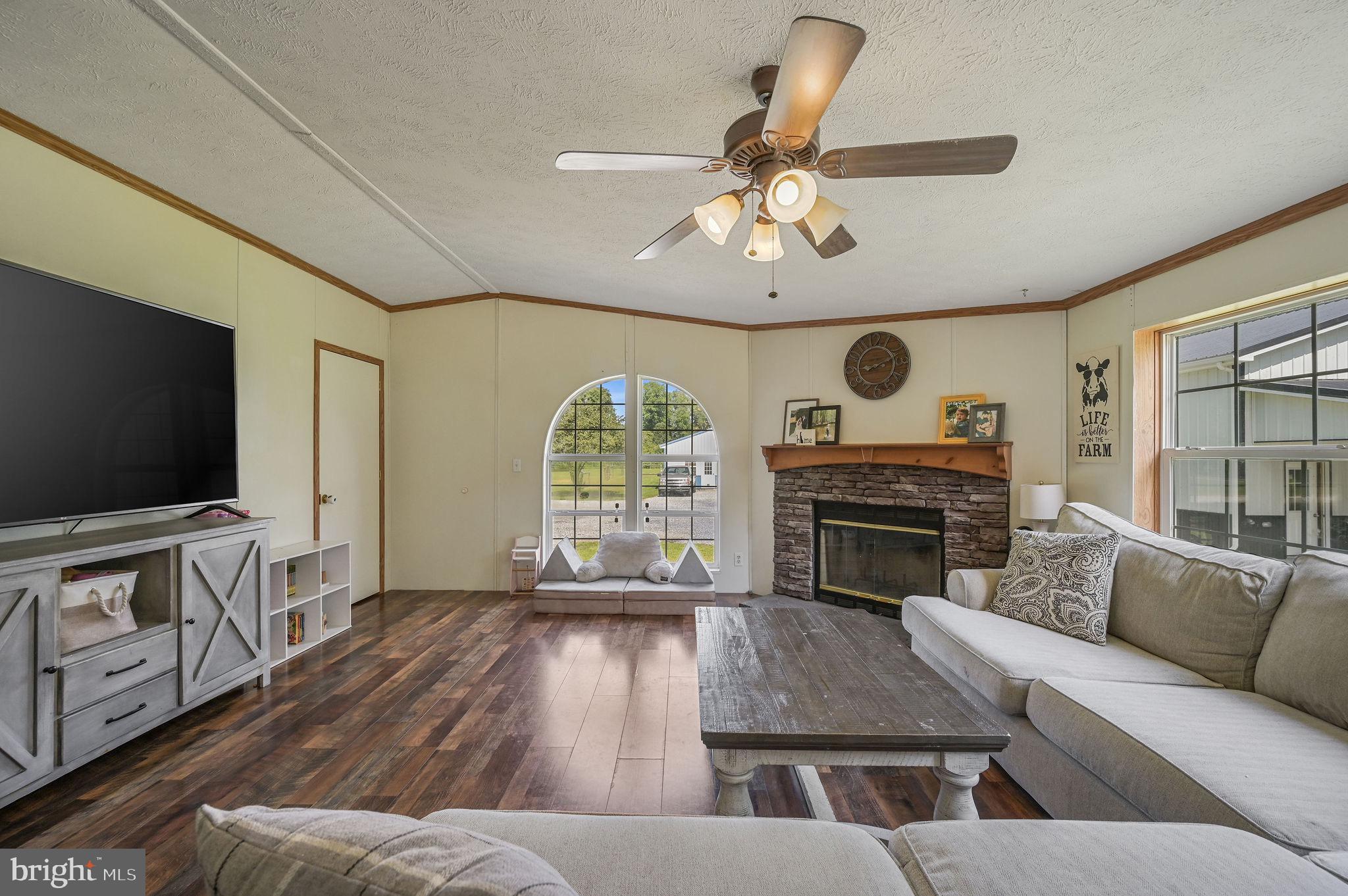 440 Indian Runner Road Felton, DE 19943 - Photo 17 of 50 a living room with furniture and a flat screen tv