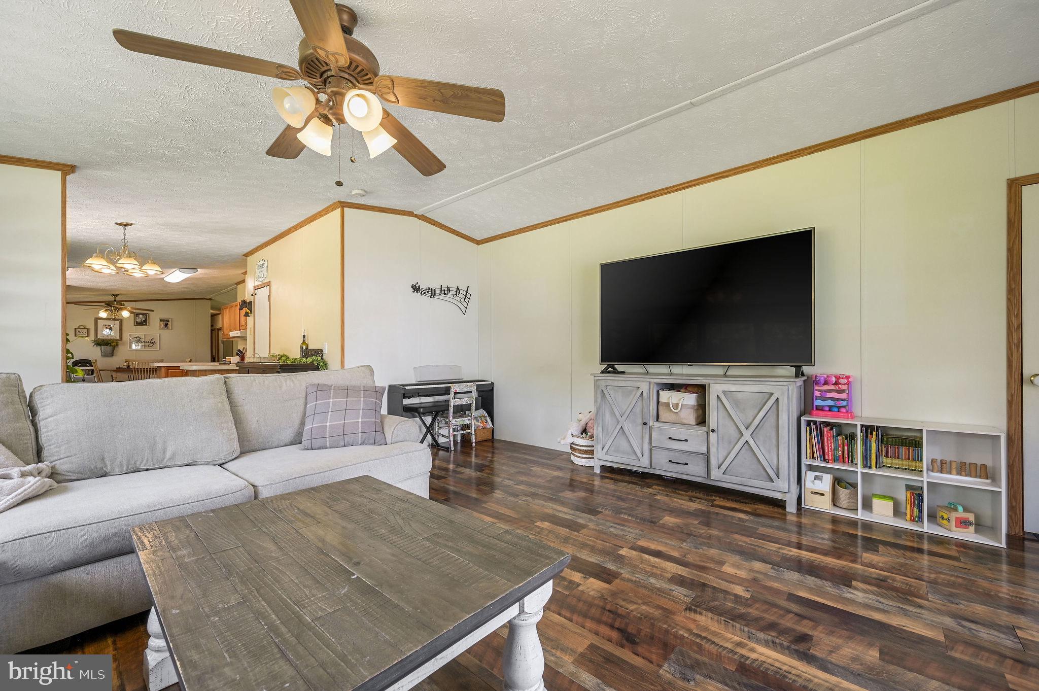 440 Indian Runner Road Felton, DE 19943 - Photo 18 of 50 a living room with furniture and a flat screen tv