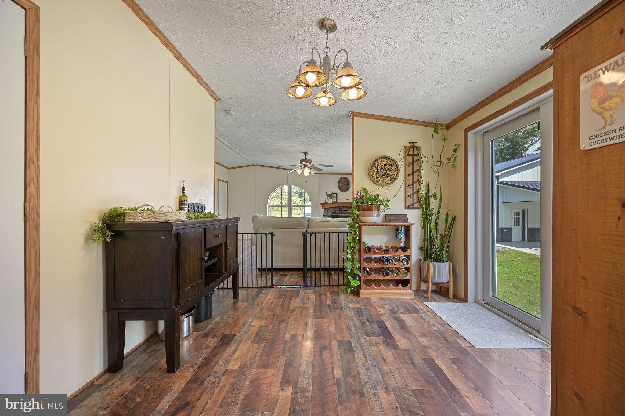 440 Indian Runner Road Felton, DE 19943 - Photo 20 of 50 a bedroom with a bed and wooden floor