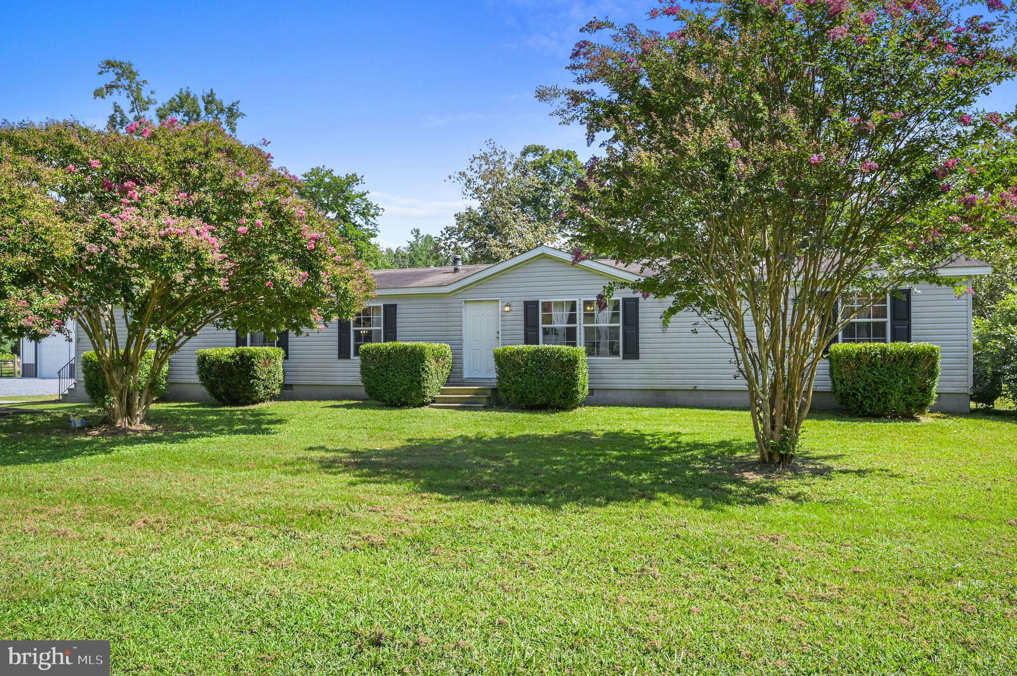 440 Indian Runner Road Felton, DE 19943 - Photo 2 of 50 a front view of a house with garden