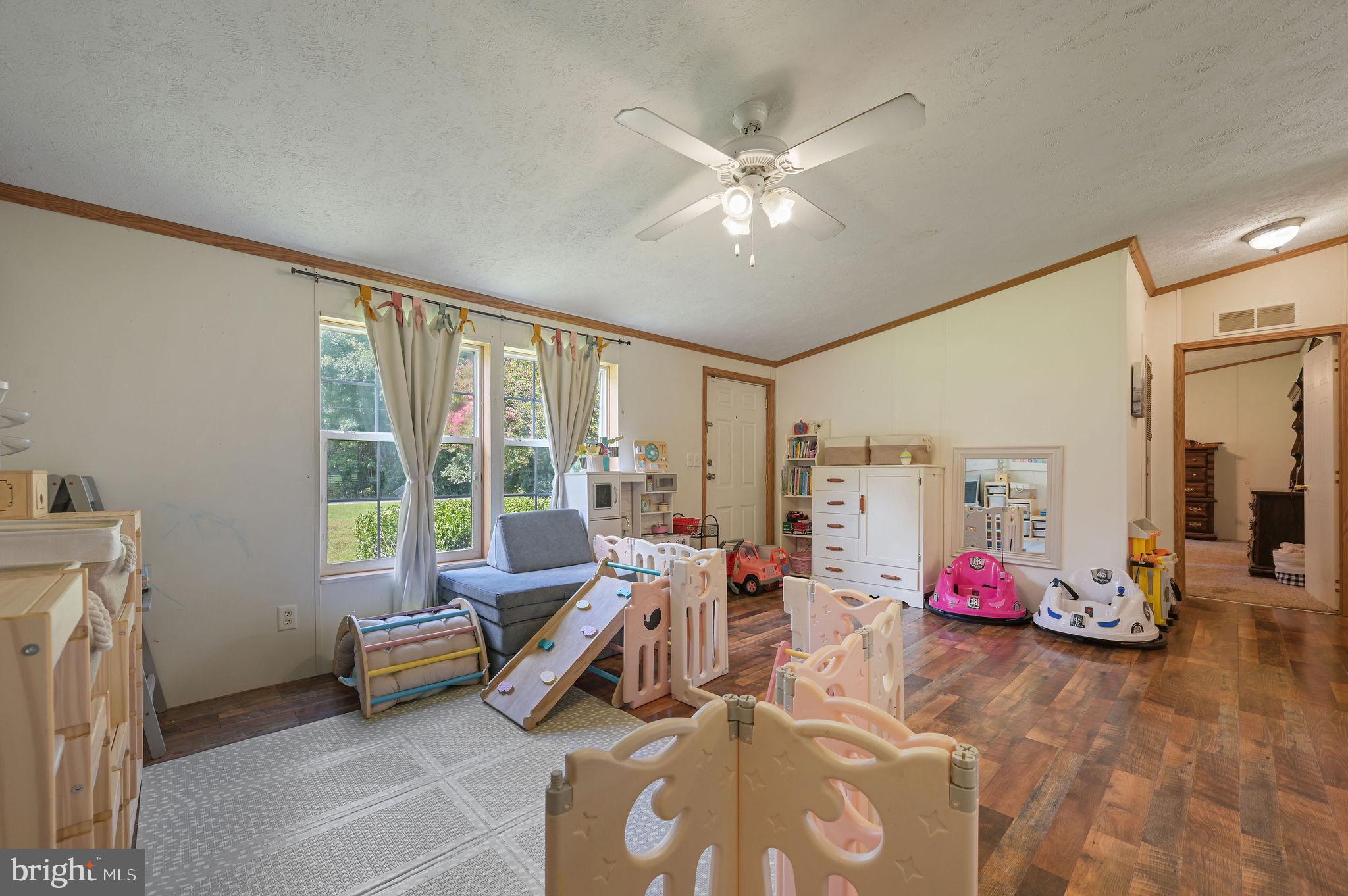 440 Indian Runner Road Felton, DE 19943 - Photo 29 of 50 a living room with furniture and a large window