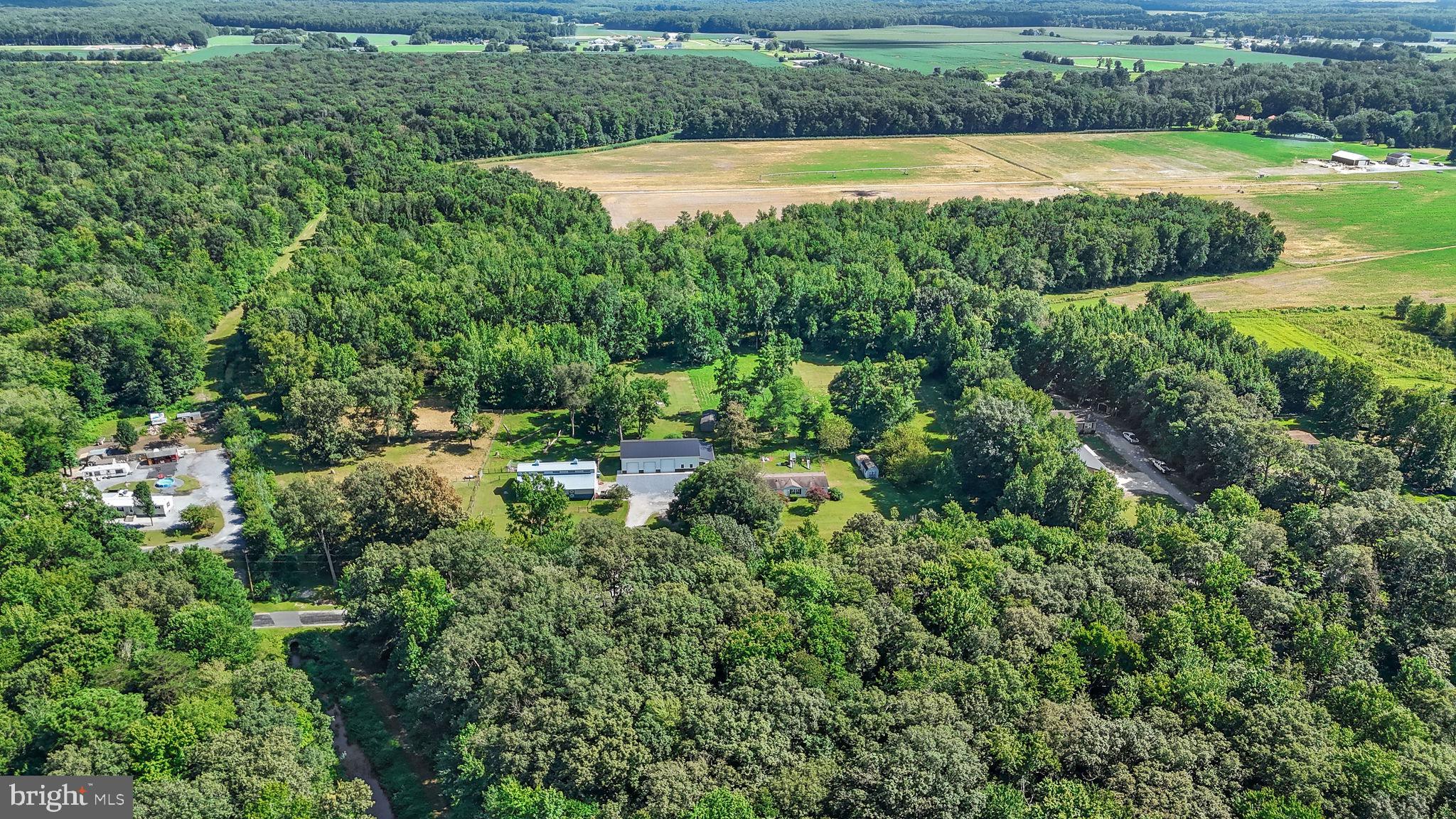 440 Indian Runner Road Felton, DE 19943 - Photo 38 of 50 a view of a swimming pool and a yard