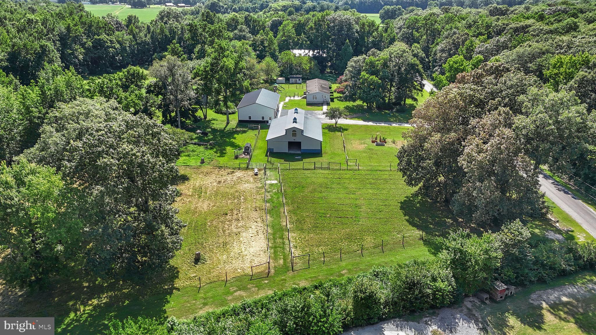 440 Indian Runner Road Felton, DE 19943 - Photo 44 of 50 a multi story building with trees in front of it