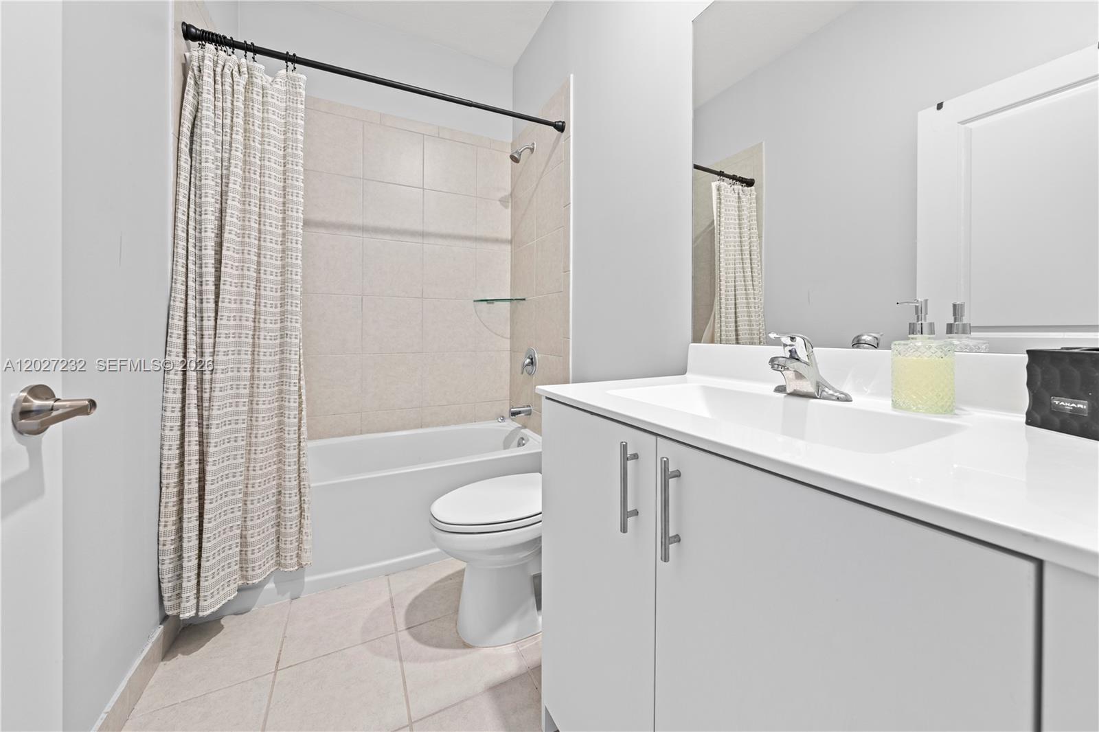 23489 Southwest 127th Place Homestead, FL 33032 - Photo 15 of 24 a bathroom with a sink a toilet and shower