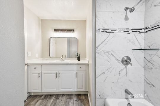 320 Dawn Court Ridgecrest, CA 93555 - Photo 18 of 24 a bathroom with a granite countertop sink and a mirror