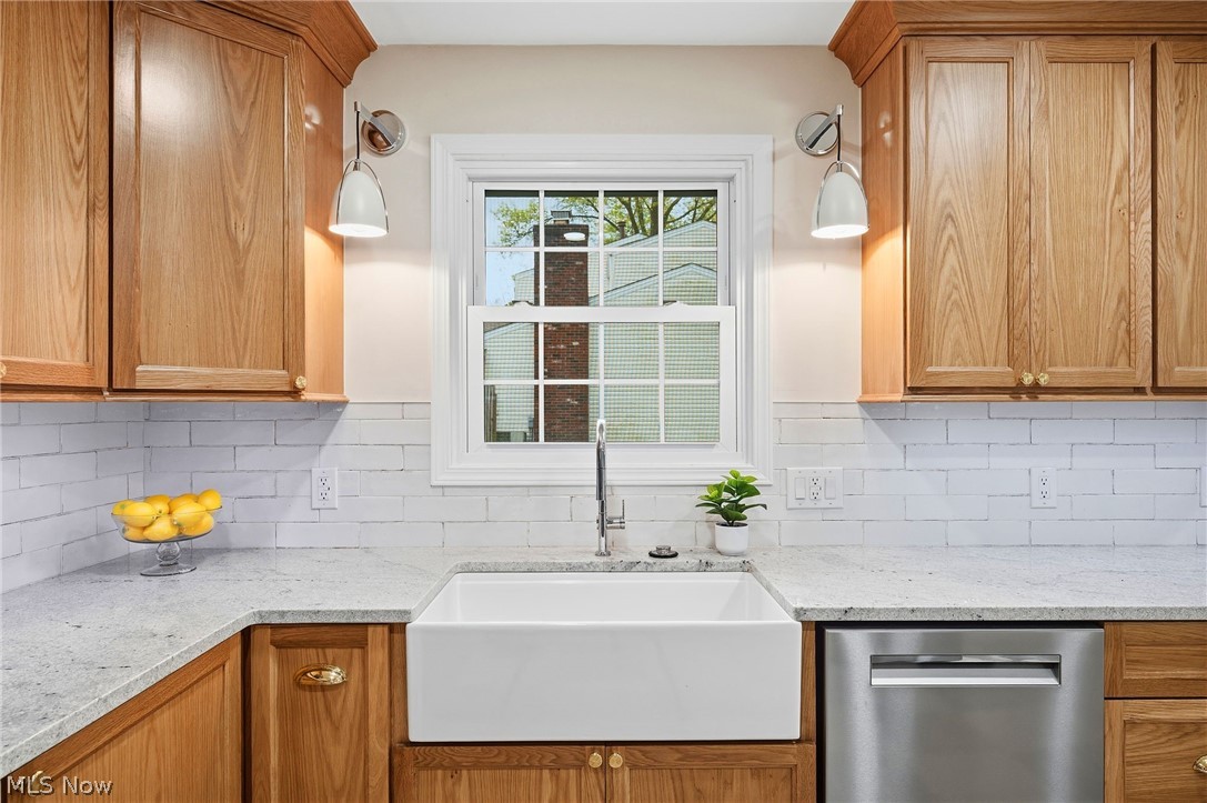 1515 Barlow Road Hudson, OH 44236 - Photo 5 of 31 Completely renovated kitchen with custom cabinetry, induction cooktop, stainless steel appliances, and porcelain tile flooring!