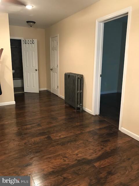 2011 Stenton Avenue, Unit A Philadelphia, PA 19138 - Photo 11 of 20 an empty room with wooden floor and closet
