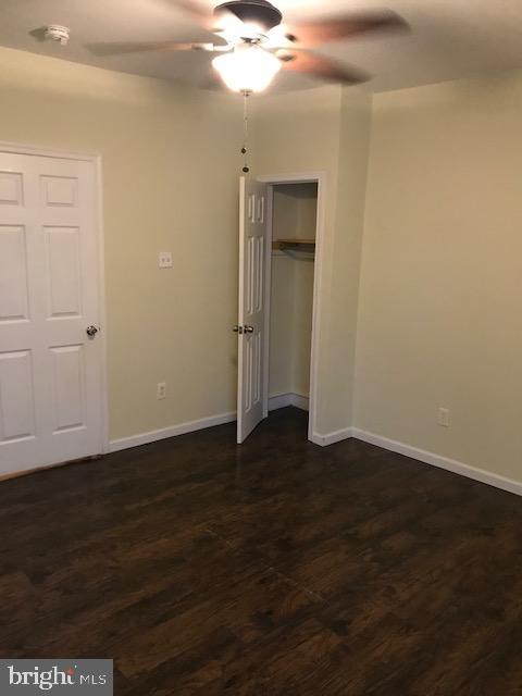2011 Stenton Avenue, Unit A Philadelphia, PA 19138 - Photo 14 of 20 an empty room with wooden floor and fan