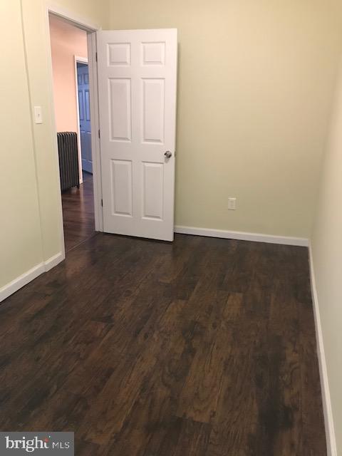 2011 Stenton Avenue, Unit A Philadelphia, PA 19138 - Photo 19 of 20 an empty room with wooden floor