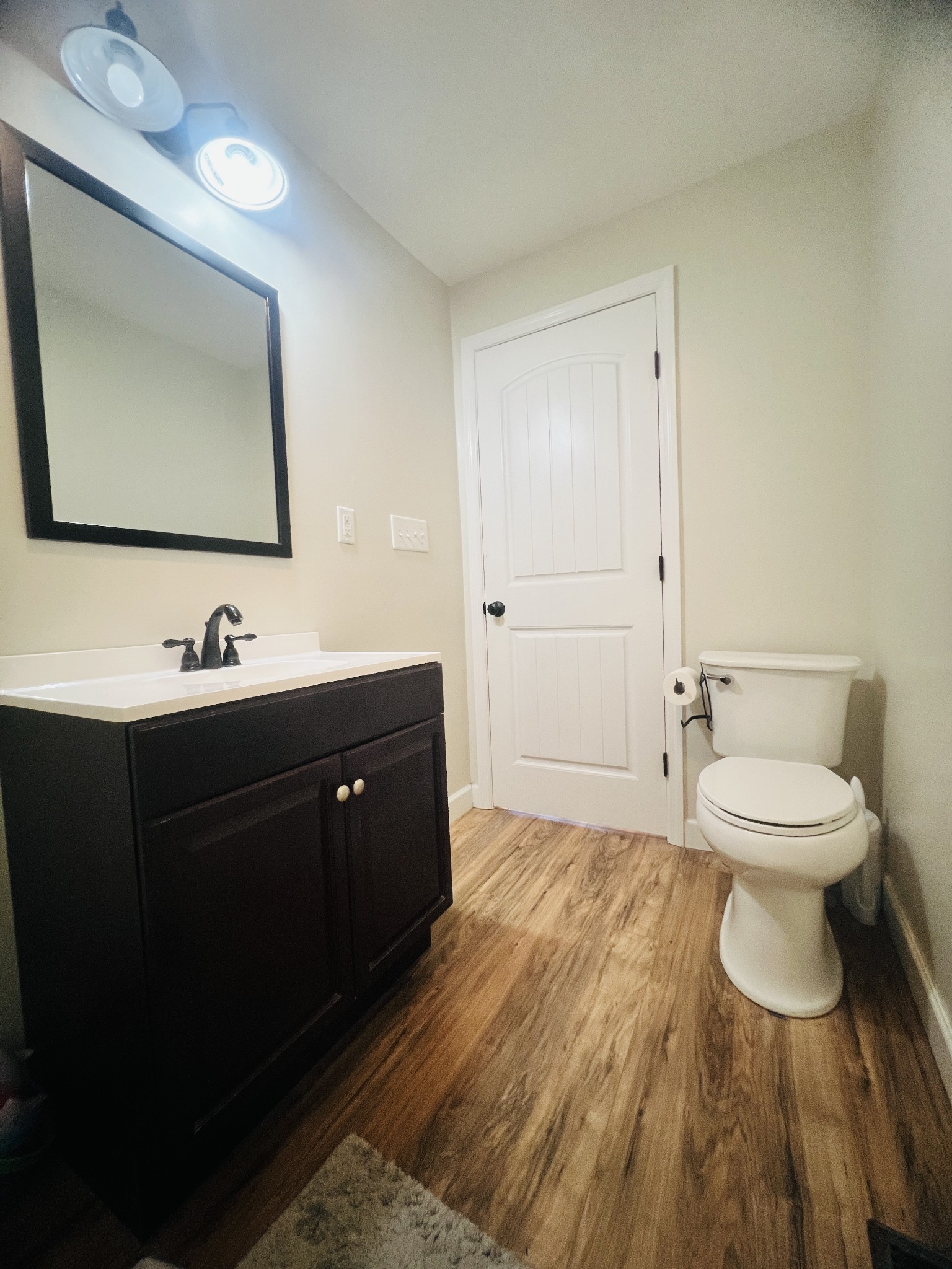 100 Locust Street Alexandria, TN 37012 - Photo 12 of 21 a bathroom with a toilet sink double vanity and mirror