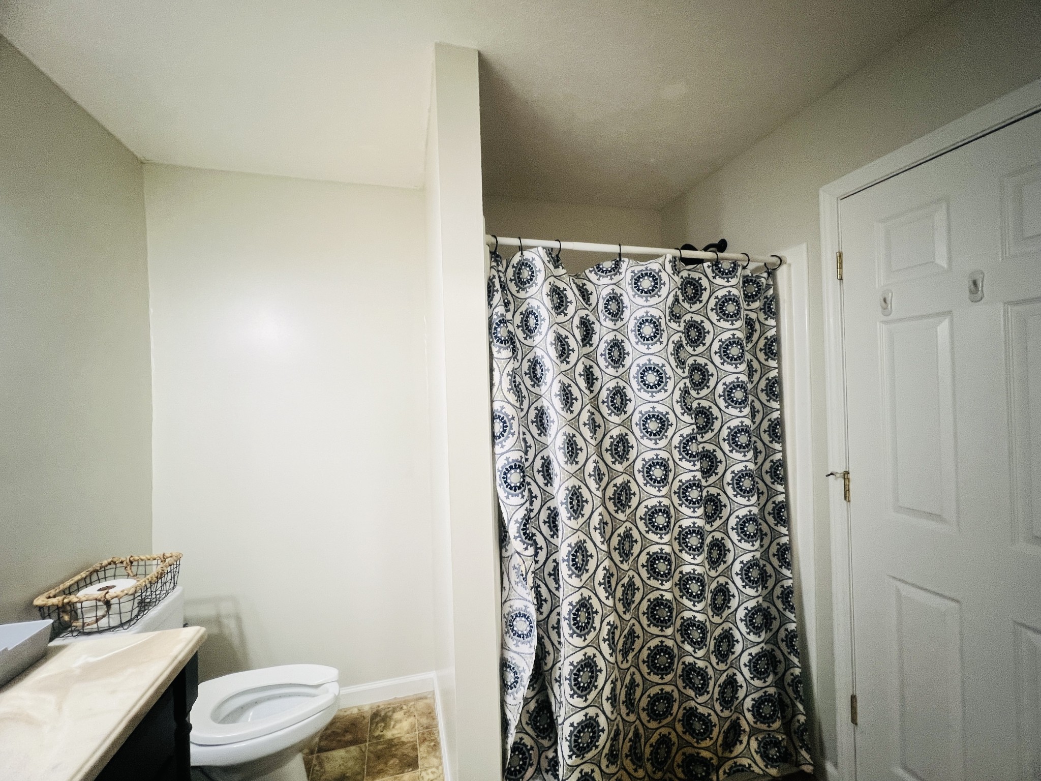 100 Locust Street Alexandria, TN 37012 - Photo 15 of 21 a bathroom with a toilet and a shower curtain