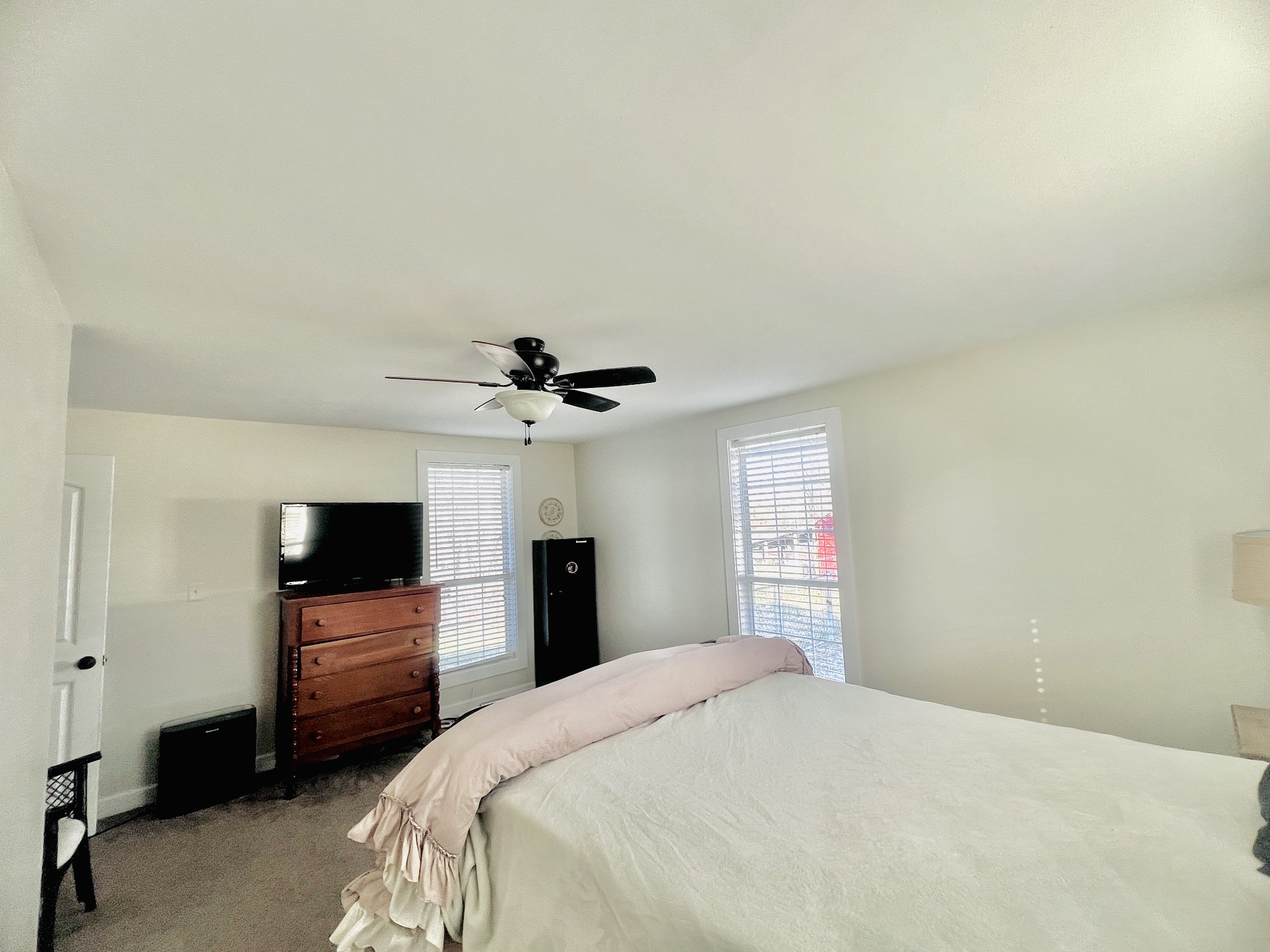 100 Locust Street Alexandria, TN 37012 - Photo 21 of 21 a bedroom with a bed and a flat screen tv