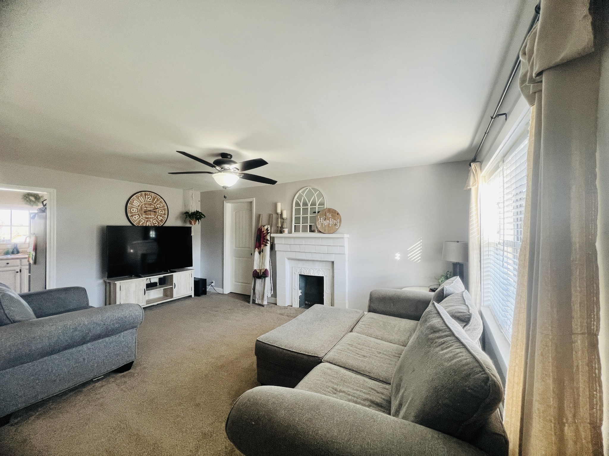 100 Locust Street Alexandria, TN 37012 - Photo 5 of 21 a living room with furniture and a fireplace