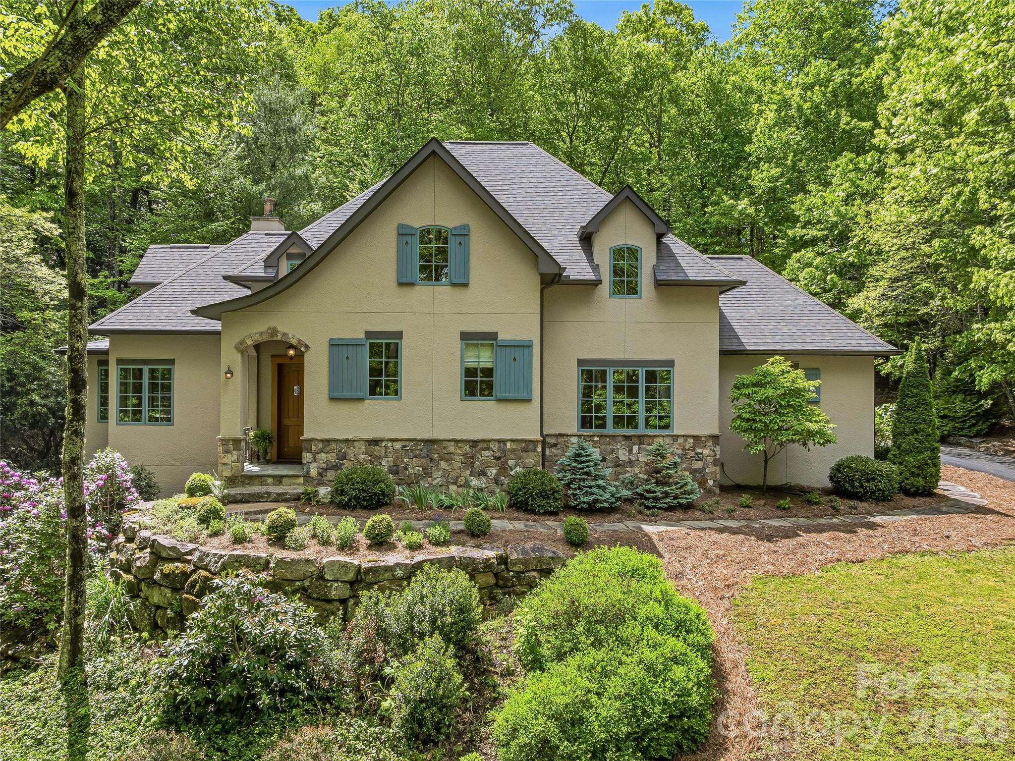 732 Streamside Drive Arden, NC 28704 - Photo 1 of 46 a view of a house with yard and sitting area