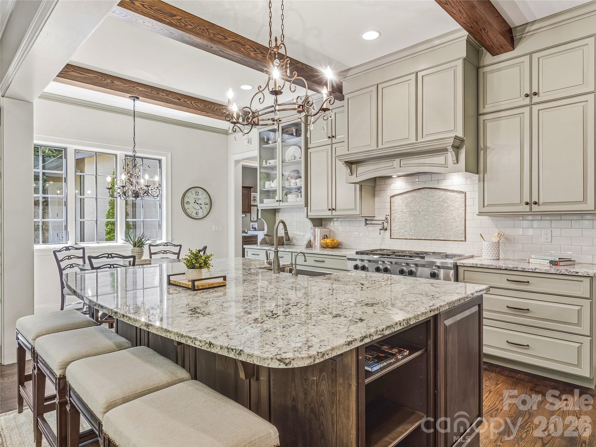 732 Streamside Drive Arden, NC 28704 - Photo 16 of 46 a kitchen with stainless steel appliances granite countertop a sink stove and cabinets