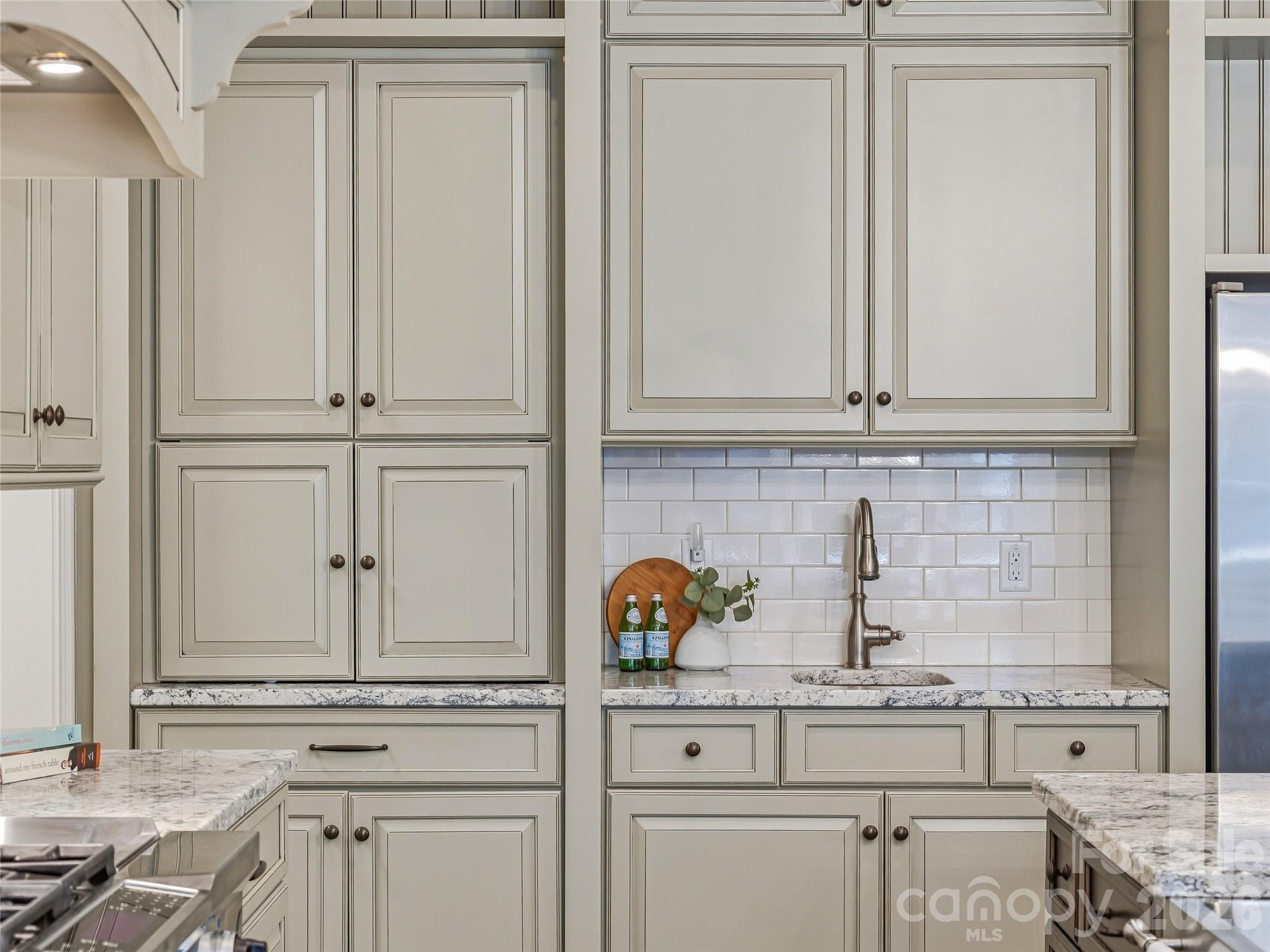 732 Streamside Drive Arden, NC 28704 - Photo 19 of 46 a kitchen with appliances cabinets and a counter top space