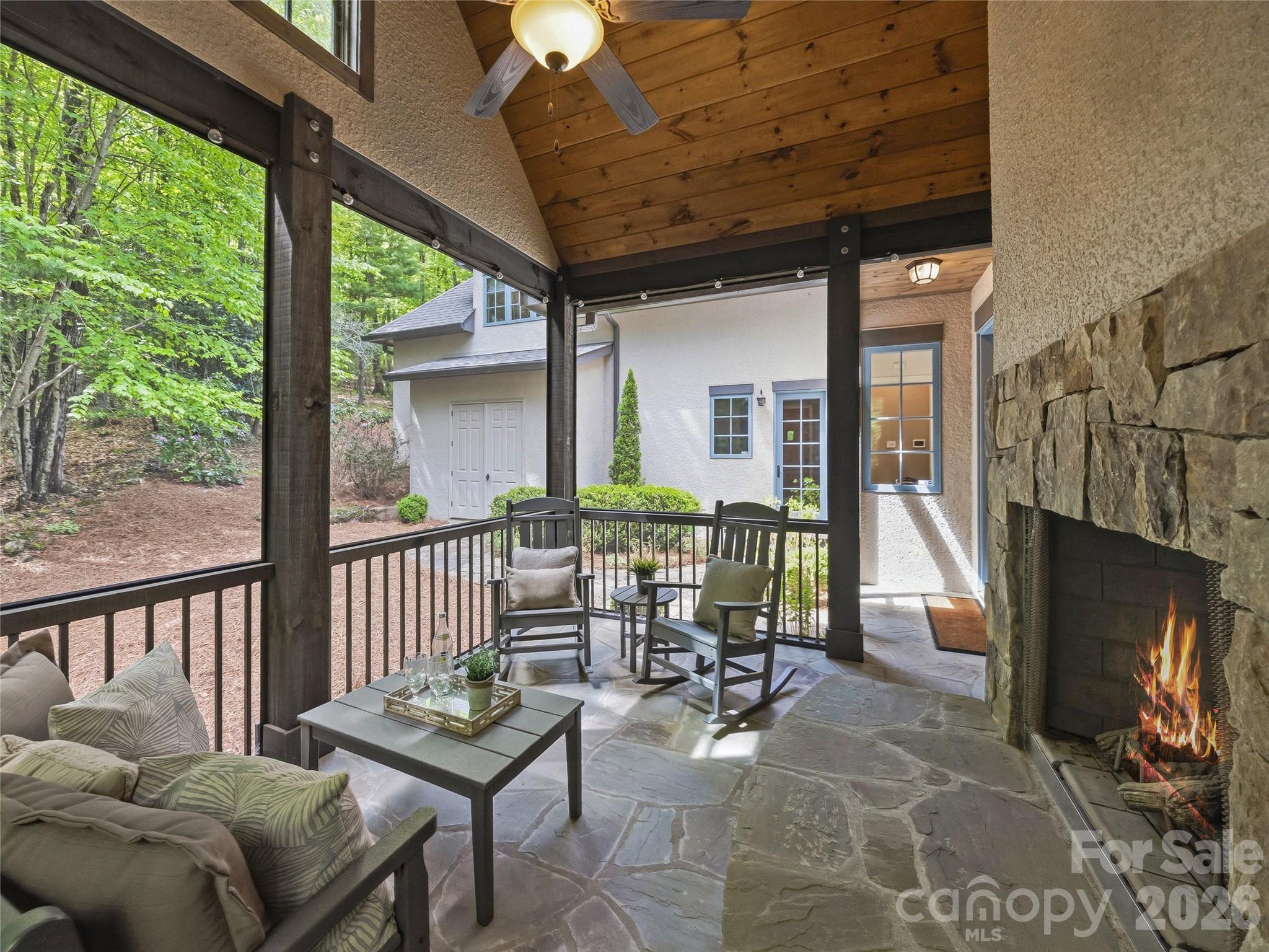 732 Streamside Drive Arden, NC 28704 - Photo 21 of 46 a outdoor living space with furniture and a fireplace