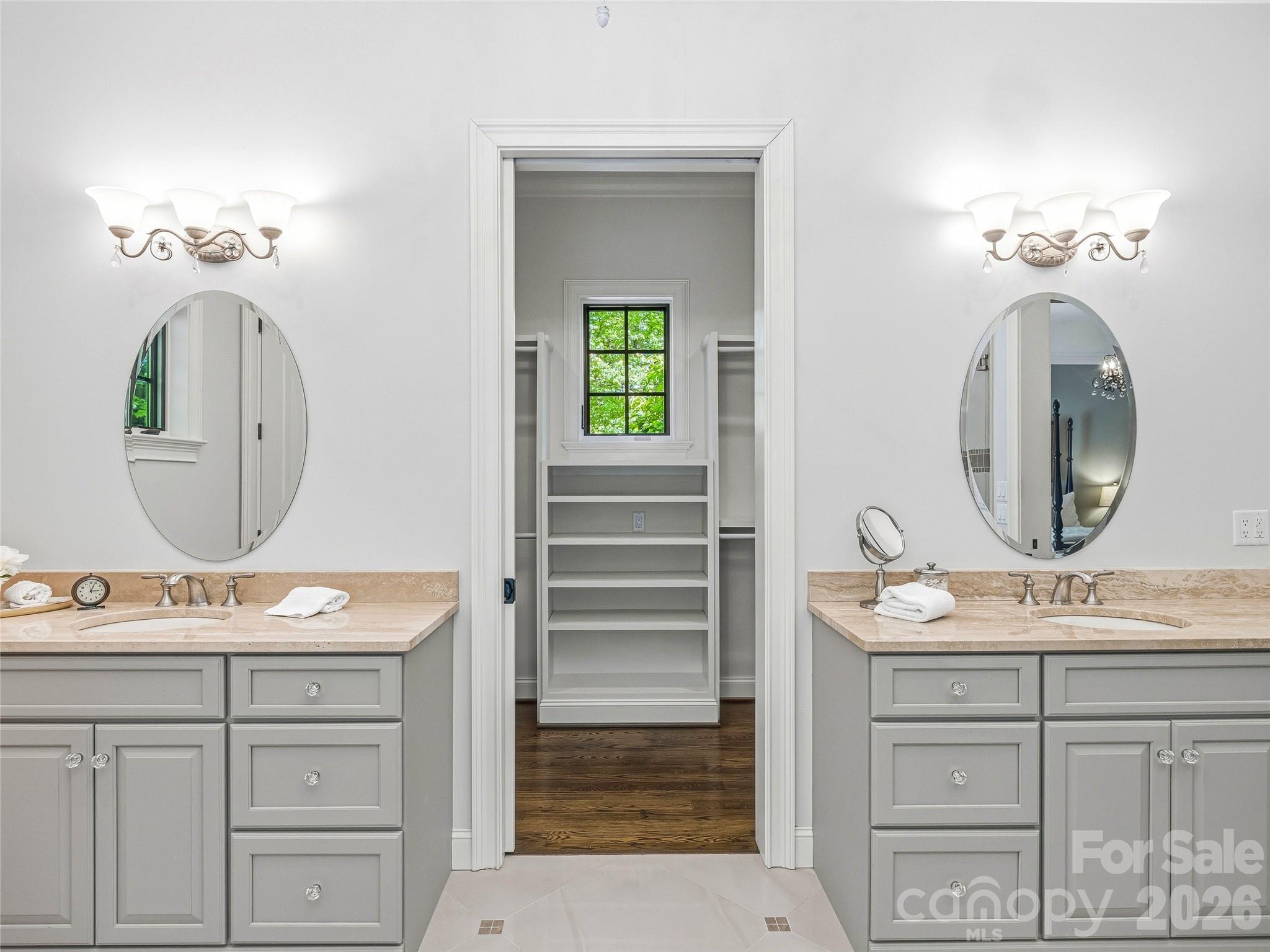 732 Streamside Drive Arden, NC 28704 - Photo 26 of 46 a bathroom with a sink vanity and a mirror