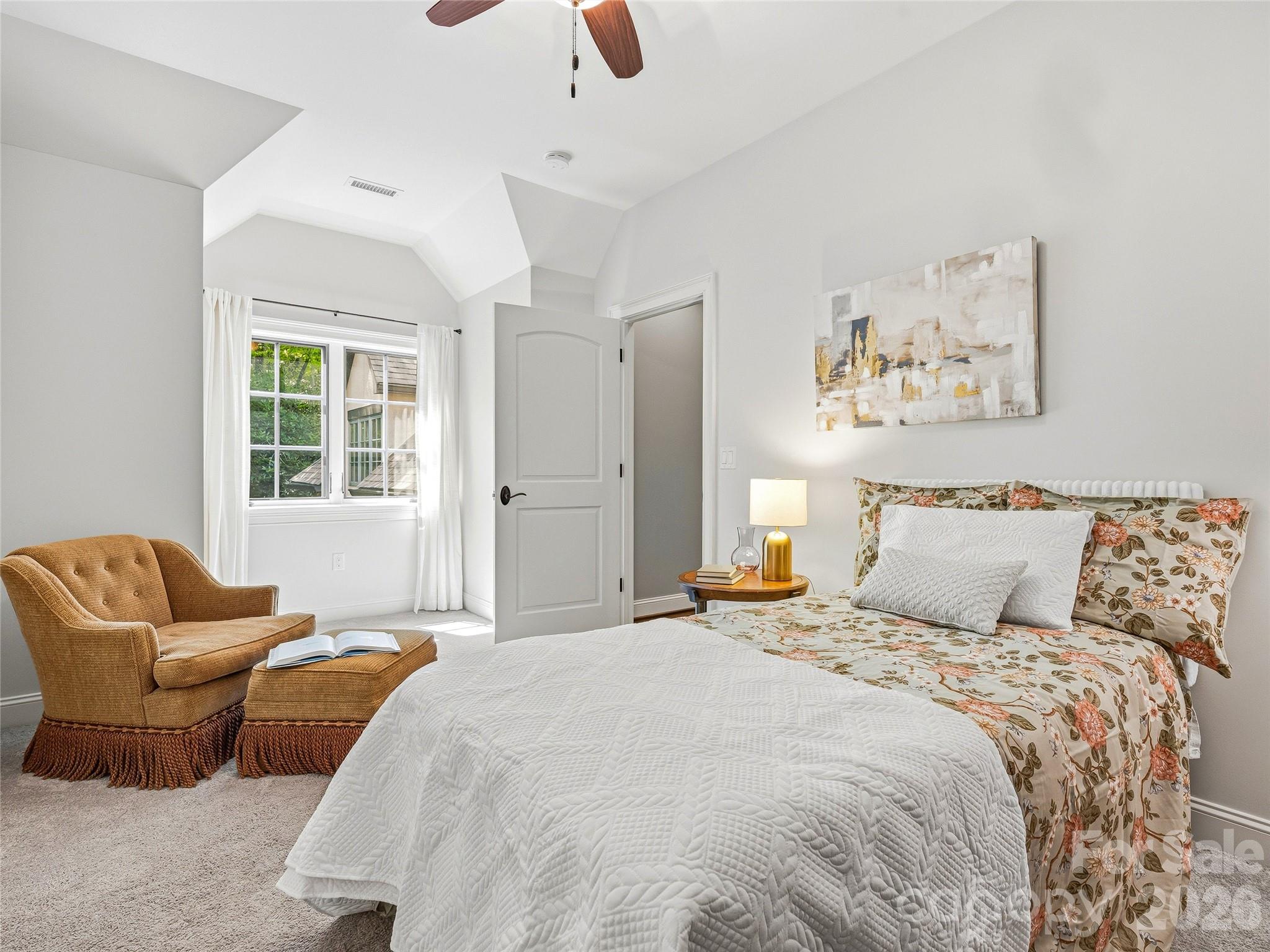 732 Streamside Drive Arden, NC 28704 - Photo 37 of 46 a bedroom with a bed couch and window