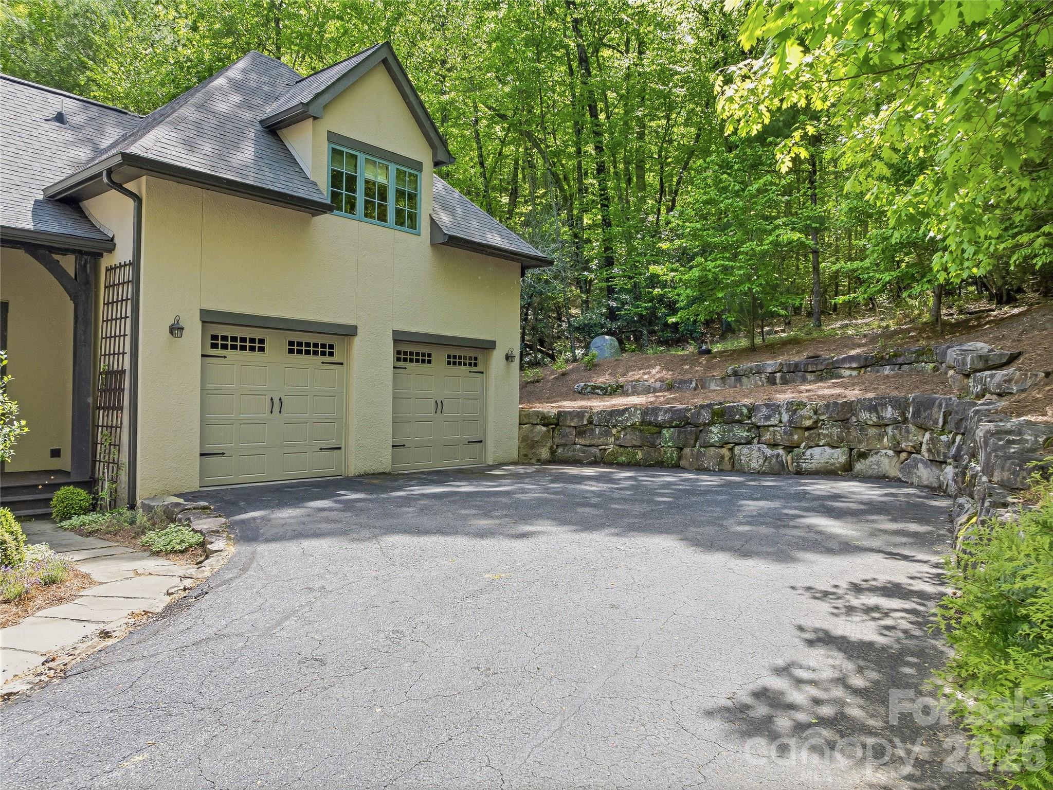 732 Streamside Drive Arden, NC 28704 - Photo 41 of 46 a front view of a house with a yard and garage
