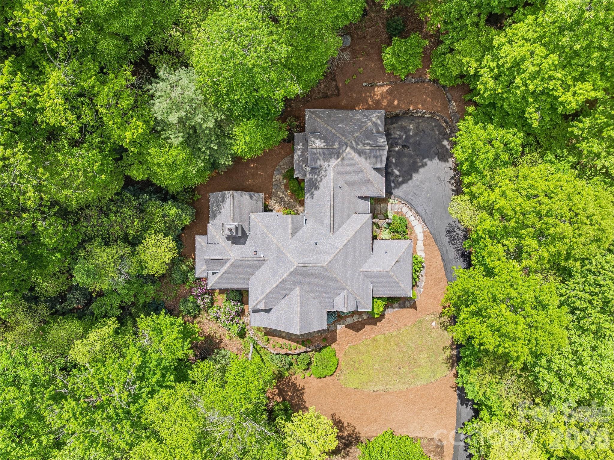 732 Streamside Drive Arden, NC 28704 - Photo 42 of 46 an aerial view of a house with a garden