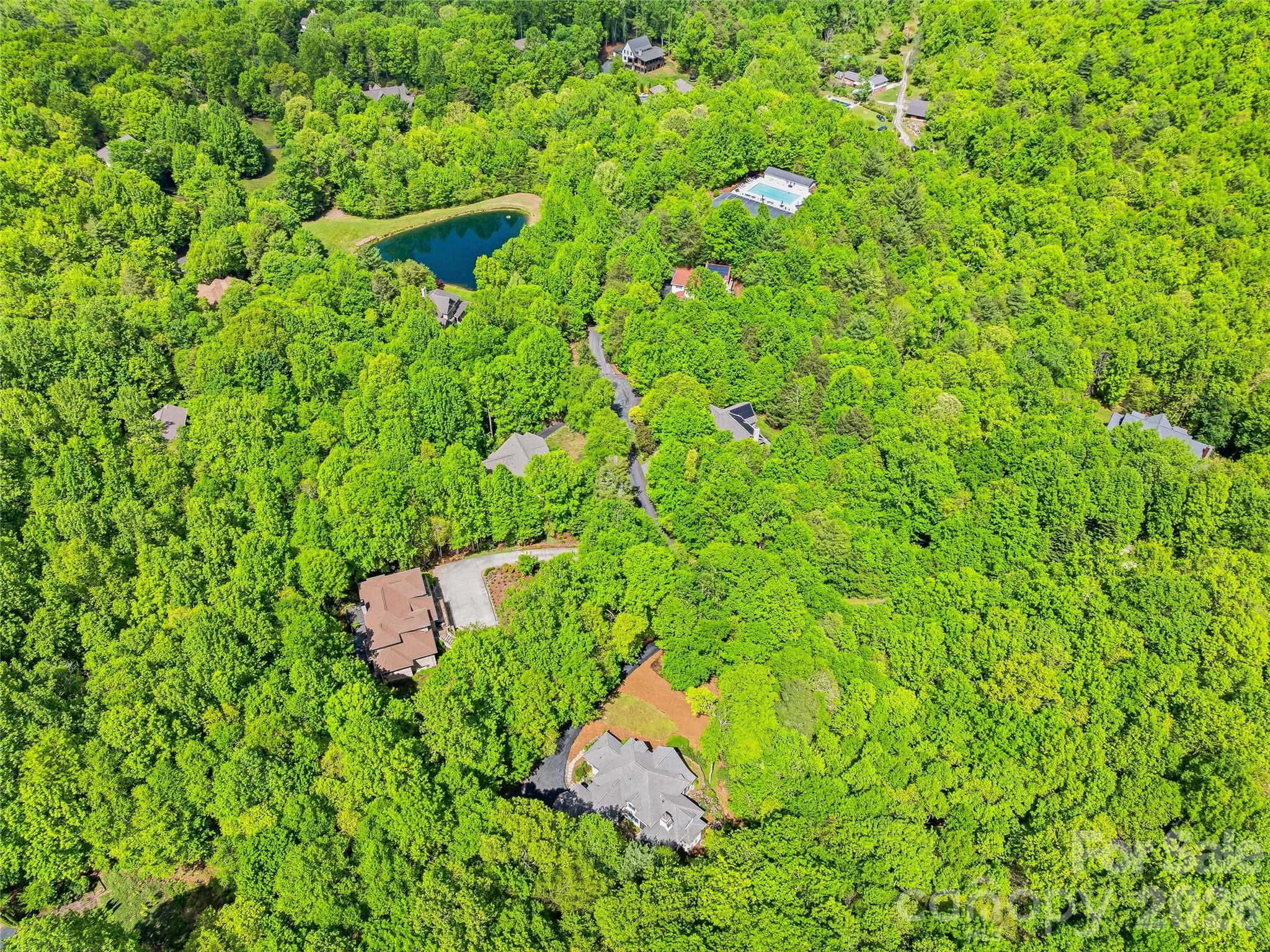 732 Streamside Drive Arden, NC 28704 - Photo 43 of 46 a view of a house with a lush green field