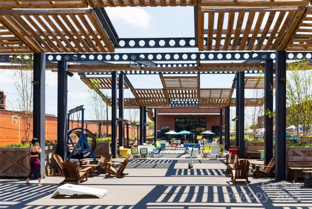a view of a swimming pool with sitting area
