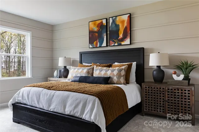 a bedroom with a bed and window