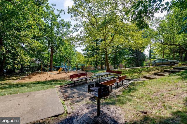 a view of a backyard with sitting area