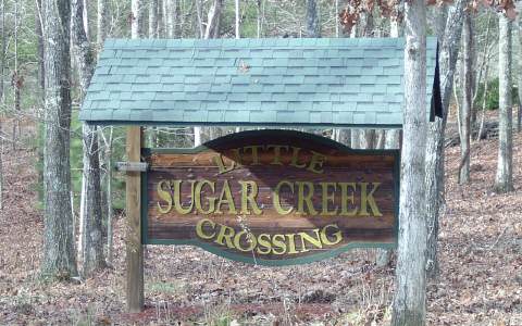 Lot10 Sugar Creek Road Blue Ridge, GA 30513 - Photo 1 of 1 a view of a wooden door with a house in the background