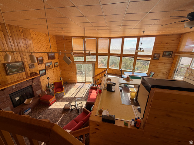 358 South Sky Drive Torrey, UT 84775 - Photo 24 of 82 Vaulted ceiling great room with extensive wood paneling and exposed wood beams