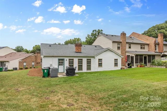 a view of a house with a backyard