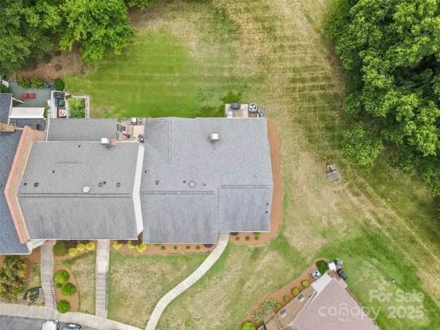 aerial view of a house with a yard