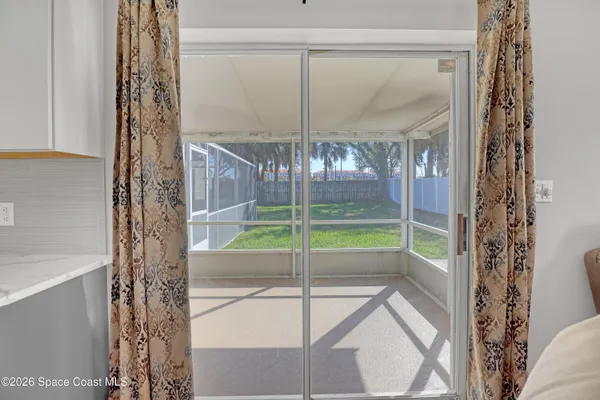 a view of an empty room and window