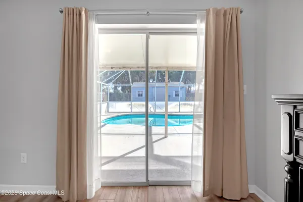 a view of a room that has a large window