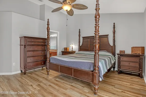a bedroom with a bed and cabinets