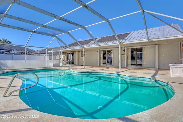 a view of a patio with swimming pool