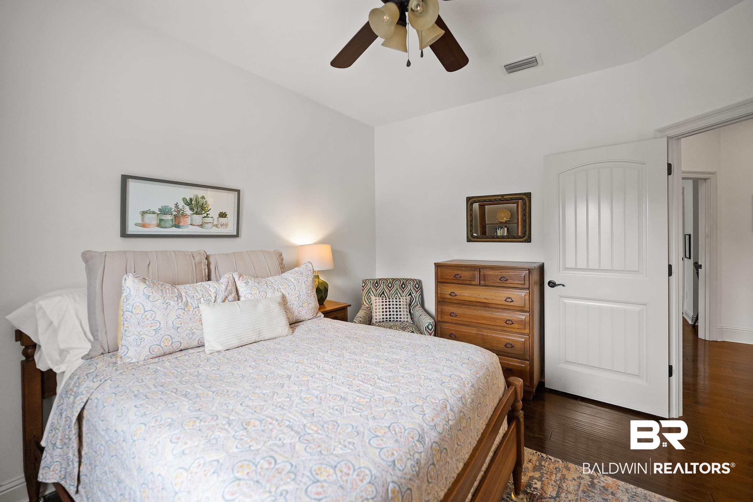313 Pecan Ridge Boulevard Fairhope, AL 36532 - Photo 20 of 51 Bright interior space featuring vaulted ceilings, wood-finish flooring, a contemporary ceiling fan, white paneled doors, and recessed lighting