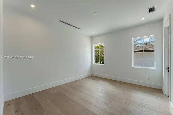 an empty room with windows