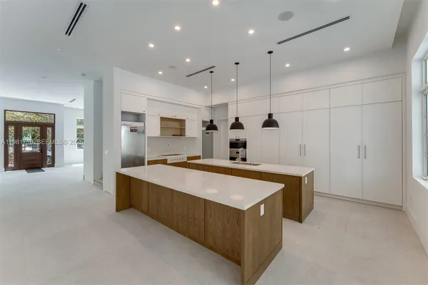a large kitchen with a large counter top