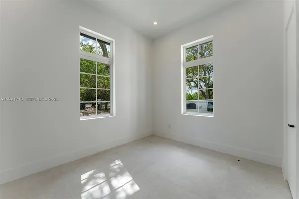 an empty room with windows